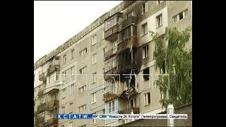 Жители взорвавшегося дома выстраиваются в очередь, чтобы забрать свои вещи