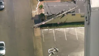 Live power pole hit by garbage truck, killing power for several Hollywood residents