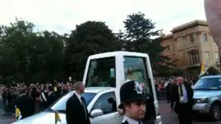 The crowd welcomes Pope Benedict XVI in his popemobile at London's  Hyde Park 18 Sept 2010