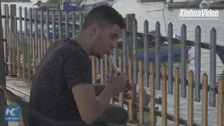 Young Gazan uses crutch as flute to play music