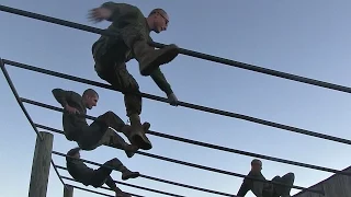 Marine Recruits Muscle Through Parris Island Obstacle Course