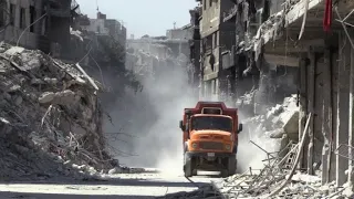 Bulldozers scoop slow way to recovery in Syria's Yarmuk