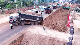 OMG!! Team Work Dump Trucks Waiting To Loading Soil Filling A Pit To Resize The Road With Huge Dozer