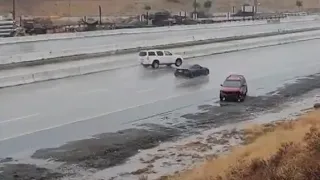 Speeding cars lose control on wet I-5