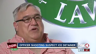 ICE files hold on suspected police shooter
