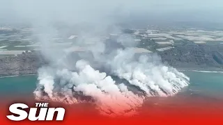 Epic drone vid of La Palma volcano creating new land mass