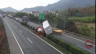 Motorist Has Near Miss WIth Falling Shipping Container