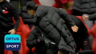 Jurgen Klopp reacts to pulling his hamstring after celebrating goal