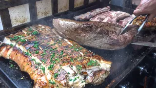 Argentina Street Food. Loads of Beef, Pork and Sausages on Grill. London