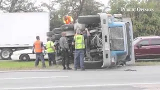 short video: Wrecker drivers prepare to remove a dump truck involved in a rollover accident on I-81