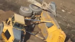 Excavators right a flipped articulated dump truck, South Charleston, WV