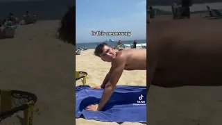 Boy Smacks Boy Booty On The Beach