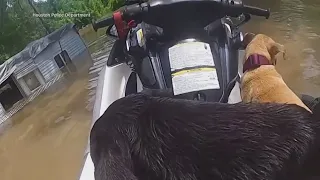 North Texas officer riding a jet ski rescues a man and dogs from flooded waters
