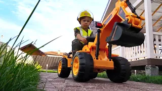 Senya Drives a Children's Tractor and Plays with Cars