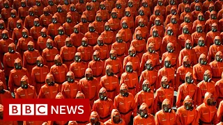North Korea’s military parade features hazmat suits and gas masks - BBC News