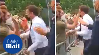 Emmanuel Macron is slapped in the face during walkabout in France