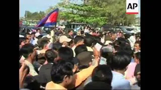 Exiled Cambodian opposition leader returns home after royal pardon