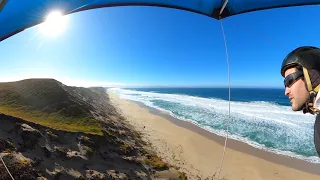 Skimming the dunes in a hang glider