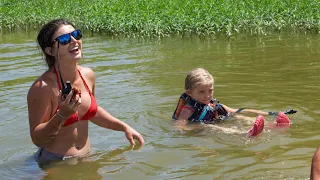 Catfish Noodling: 7 Year Old Girl Catches Huge Blue Cat!