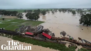 New Zealand floods: drone footage shows derailed train and landslides