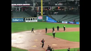 MLB Grounds crew restores the rain drenched field to playable conditions