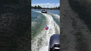 25hp Evinrude Etec killing it with a 4 man tube