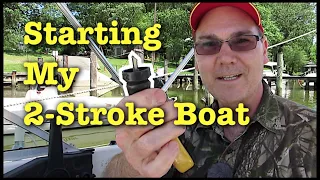 Starting the Evinrude 90 HP 2 stroke outboard boat engine.