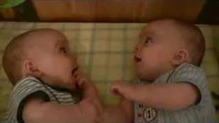 Twin Baby Boys Laughing at Each Other