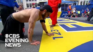 Veteran crawls across Boston Marathon finish line in honor of fallen Marines