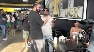 Drake walks into Trill Burgers