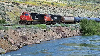CN And CP Running Trains Thru Canadas Canyon Beside The High Flowing Thompson River, CN Ashcroft Sub