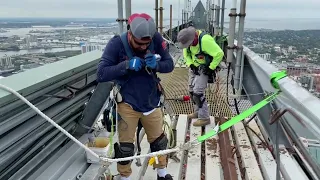 Roofing crew gets stunning views atop Tampa's tallest building