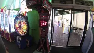 Jon beating the high score on the spider box and scaring an old lady