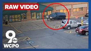 RAW VIDEO: Woman runs over innocent bystander at grocery store after striking intended target