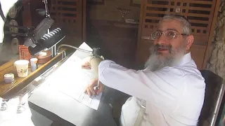 A Jewish scribe begins to write a new Torah scroll (Genesis). The ancient synagogue, Masada Israel