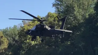 2 North Carolina National Guard Boeing AH-64 Apache helicopters flying over the Cape Fear River