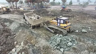 Best Equipment Machine Dozer Push Stone mud and Trucks Spreading Stone Rock Mud to Delete Lake