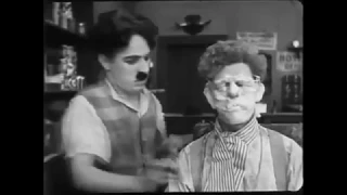 Charlie chaplin as a barber