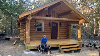 Log Cabin Build Part 30, building the porch, claw foot tub, countertops, shed for hot water heater