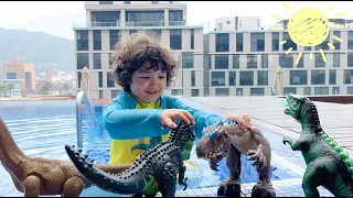 Emin rescues his dinosaur toys | Playtime by the pool
