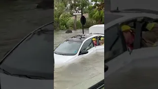 Firefighters rescue woman from flooded car in Naples, Florida