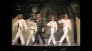 Peter Allen dancing with chorus boys