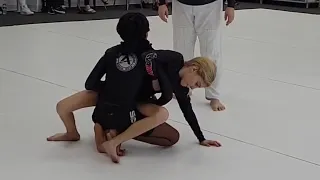 Summer learns a BJJ sweep from guard 11/15