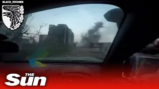 Ukrainian soldiers come under heavy fire while driving through Bakhmut