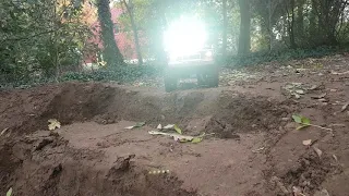 Traxxas TRX-4 Ford Bronco steep hill climb and descent in the forest (short clip)