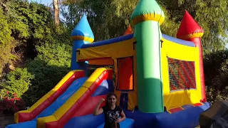 Fun in the Jumper castle with a slide