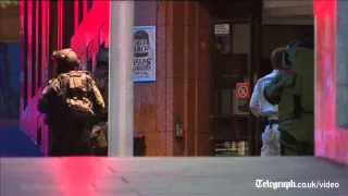 Sydney cafe siege: gunfire breaks out after hostages flee