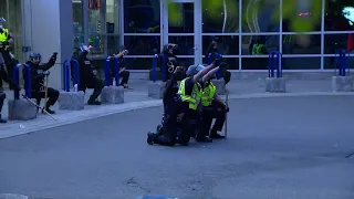 Crowd cheers as Boston officers 'Take a Knee' outside police HQ