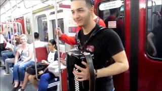 "Despacito" Accordion Player Continues on TTC Train Despite Warning