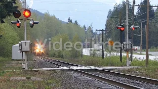 Freight Train Crossing Side Road in British Columbia | Videotime